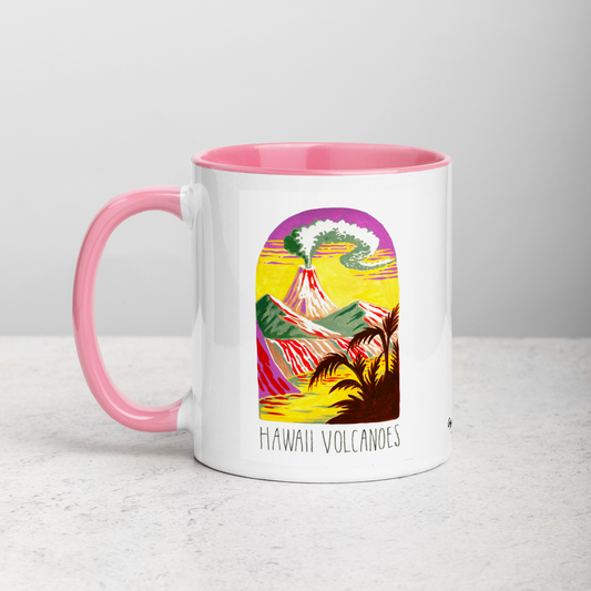 White ceramic coffee mug with pink handle and inside; has Hawaii Volcanoes National Park illustration by Angela Staehling