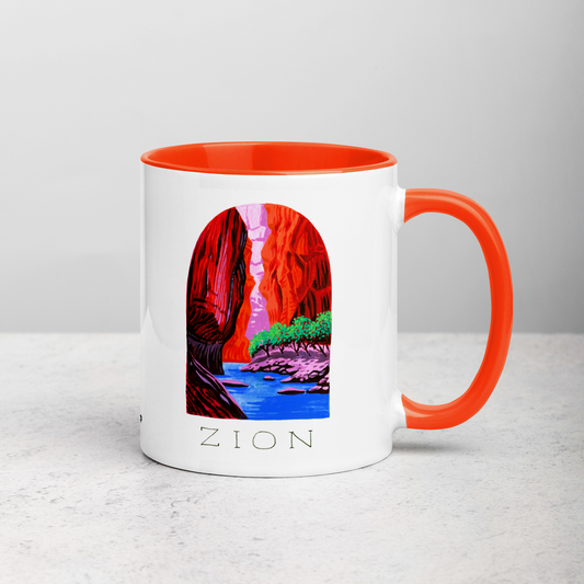 White ceramic coffee mug with orange handle and inside; has Zion National Park illustration by Angela Staehling